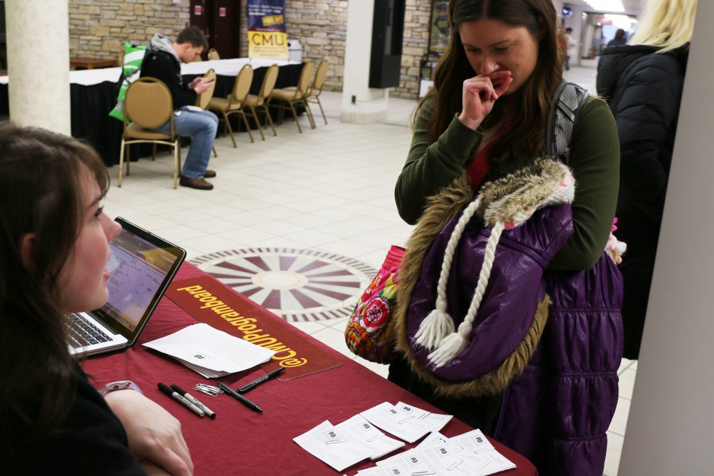 A student debates what time slot to reserve at the CMU Program Board’s Psychic Fair on Thursday January 15, 2015.  (Photo I Kaiti Chritz)  