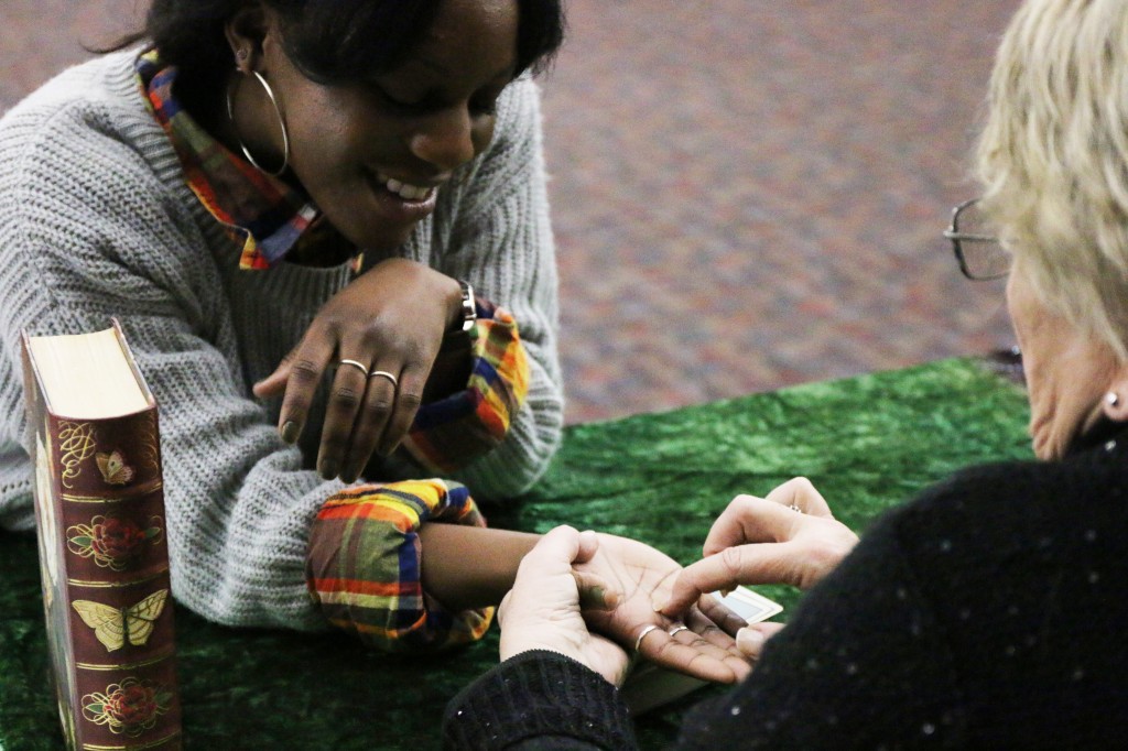 Lauren Lynn has her palm read at CMU Program Board’s Psychic Fair on Thursday January 15, 2015. (Photo I Kaiti Chritz)  