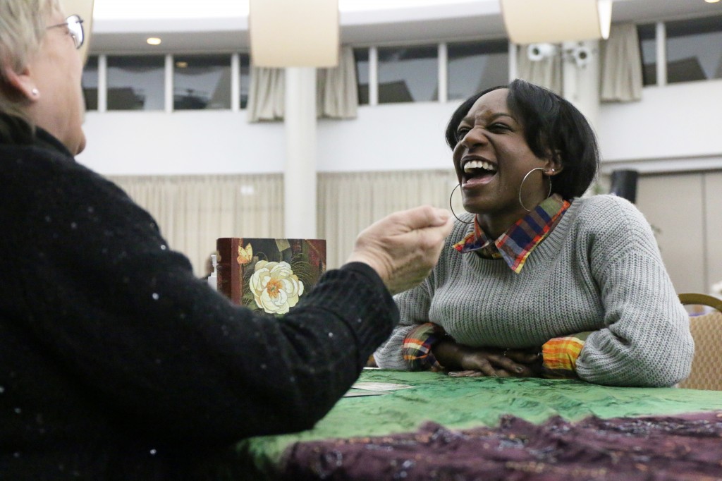 Lauren Lynn laughs with Psychic Pam Sekula during her reading at CMU Program Board’s Psychic Fair on Thursday January 15, 2015. (Photo I Kaiti Chritz)  