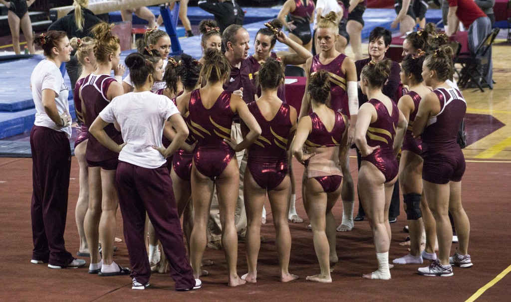 The Central Michigan University gymnastics team gathers before a meet in McGuirk Arena, on the campus of Central Michigan University, Mount Pleasant, Michigan, Friday, February 6, 2015. (Photo I Rich Drummond)
