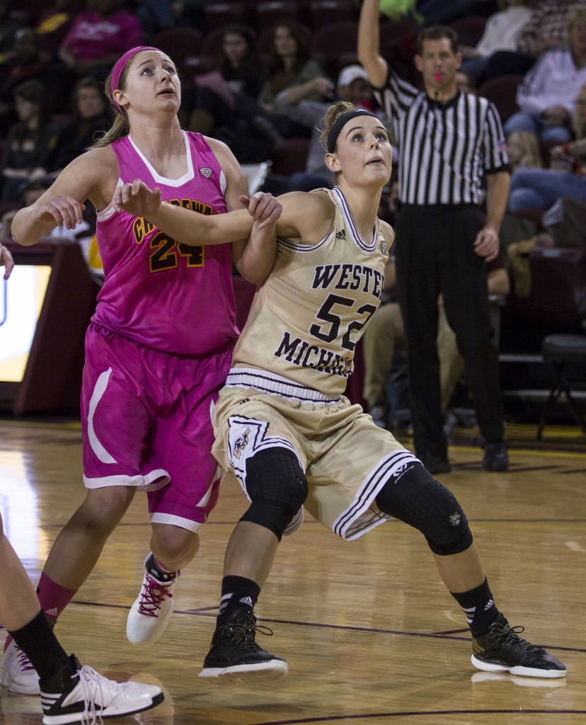 Central Michigan's Karli Herrington, (24), is boxed out by Western Michigan's Jessica Jessing, (52), during their game in McGuirk Arena, on the campus of Central Michigan University, Mt. Pleasant, Michigan, Saturday, February 21, 2015