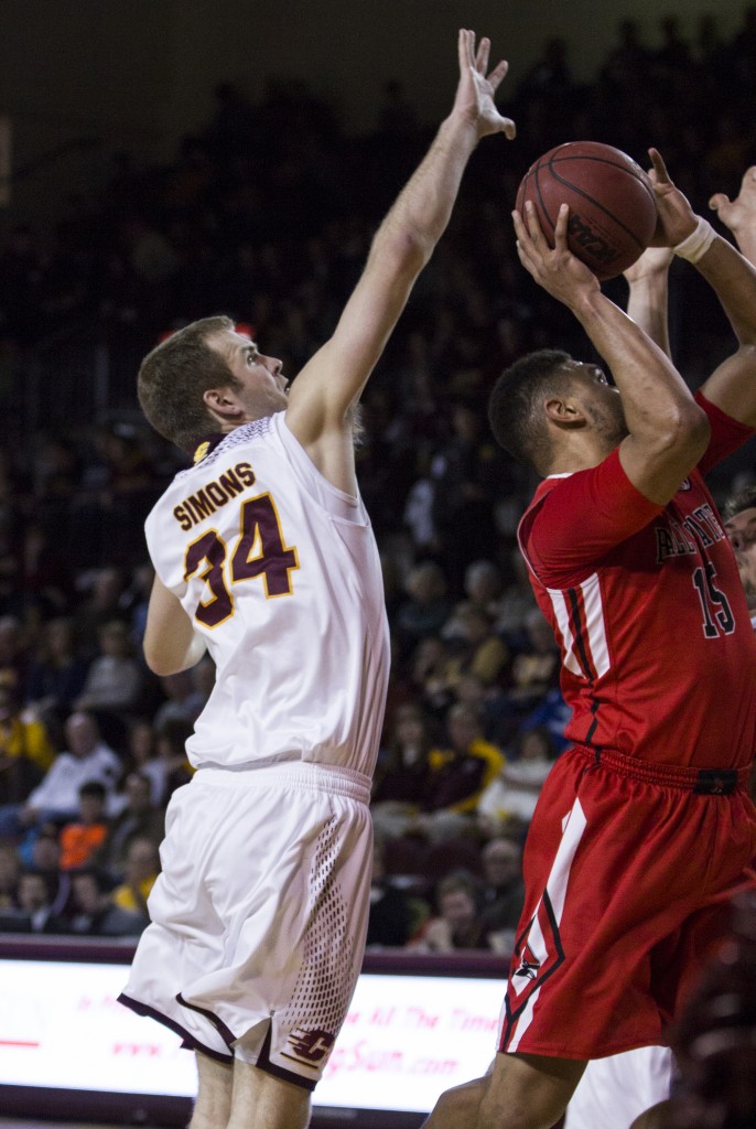 Central Michigan's John Simons, (34), defends Ball State's Franko House, (15), during their game in McGuirk Arena, on the campus of Central Michigan University, Mt. Pleasant, Michigan, Saturday, February 21, 2015