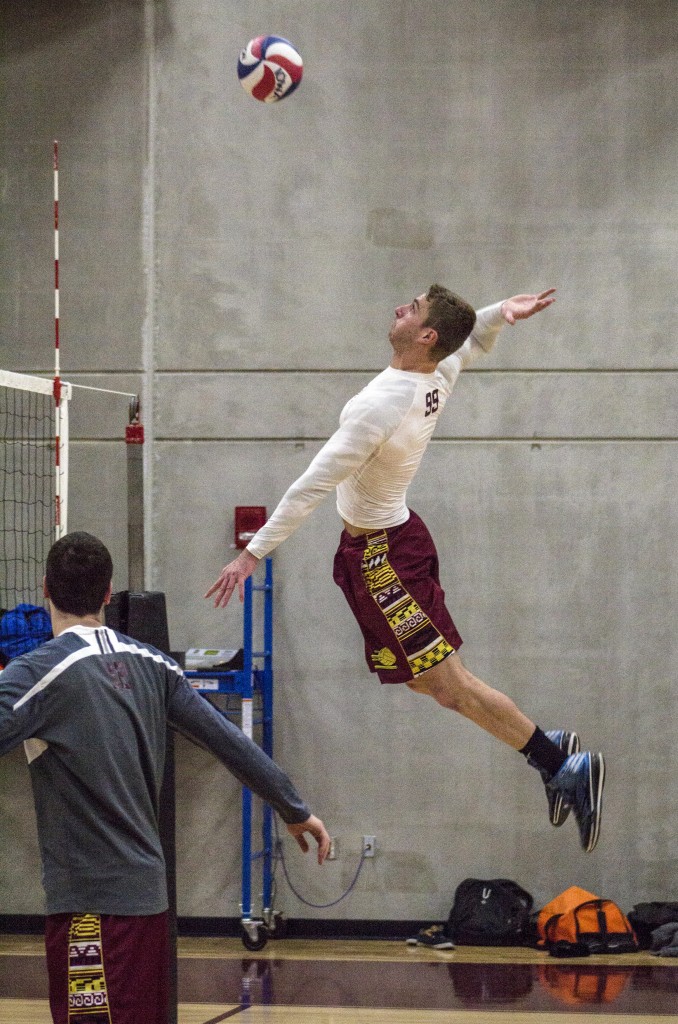 Sean Beatty practices his spike during their practice in McGuirk Arena on the campus of Central Michigan University, Mt. Pleasant, Michigan, Tuesday, February 17, 2015. (Photo I Rich Drummond) 