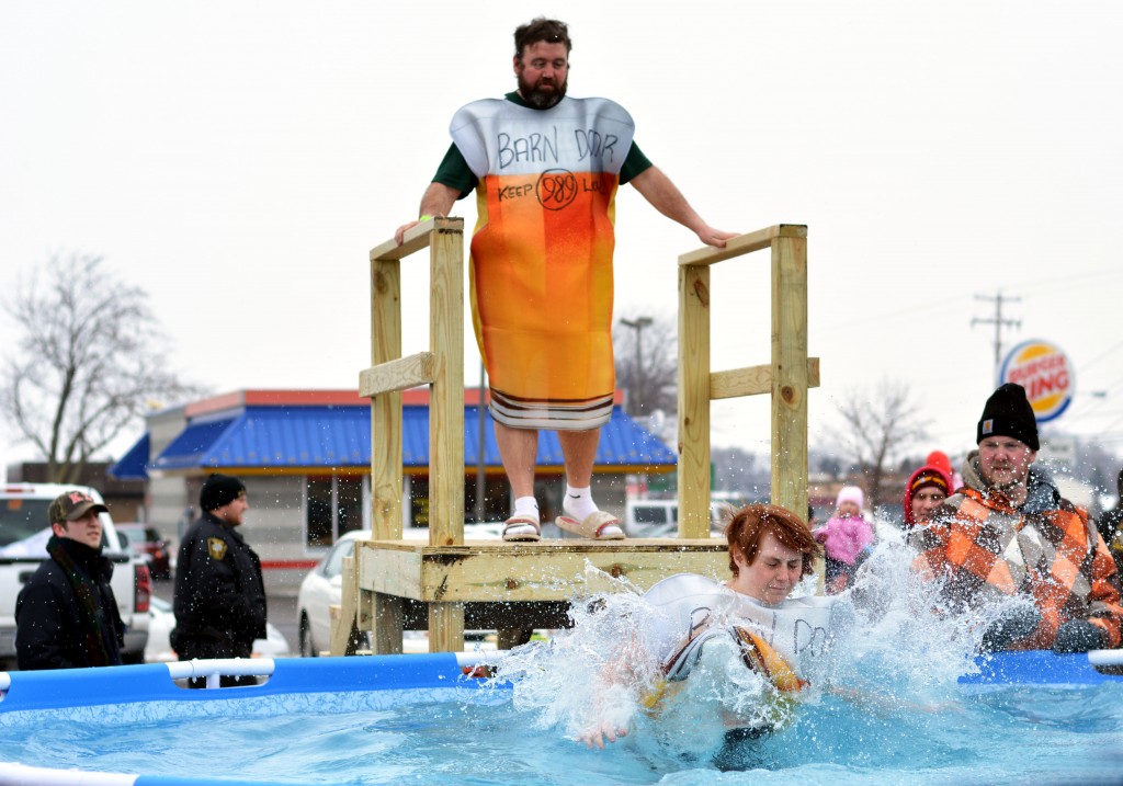 One participant of the Mount Pleasant Polar Plunge waits to jump as his teammate exits the pool. (Photo | Andrea Henk)
