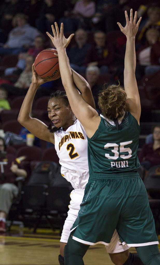 Central Michigan's Lorreal Jones, (2), works the paint against Eastern Michigan's Brianna Puni, (35). (Photo I Rich Drummond)