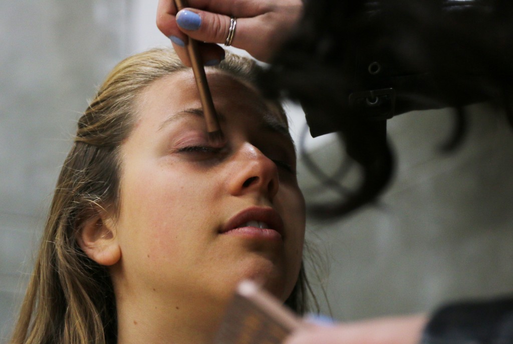 Delaney Dillon, a model at the 2015 Threads Fashion Show, gets her makeup done before the show Saturday, April 25, 2015. (Photo I Kaiti Chritz)