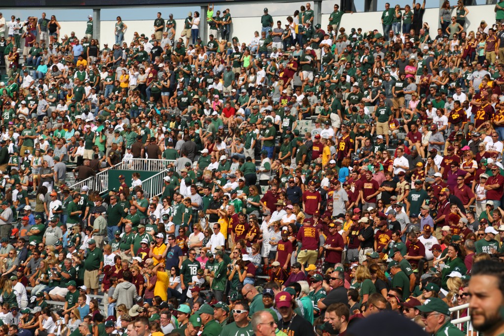 Central Michigan University students cheer on the Chippewa's as they play Michigan State at Spartan Stadium on Saturday, September 26, 2015. 