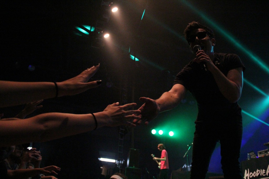 Hoodie Allen reaches out in the crowd during his performance in McGuirk Arena on the campus of Central Michigan University, Friday, October 2, 2015.