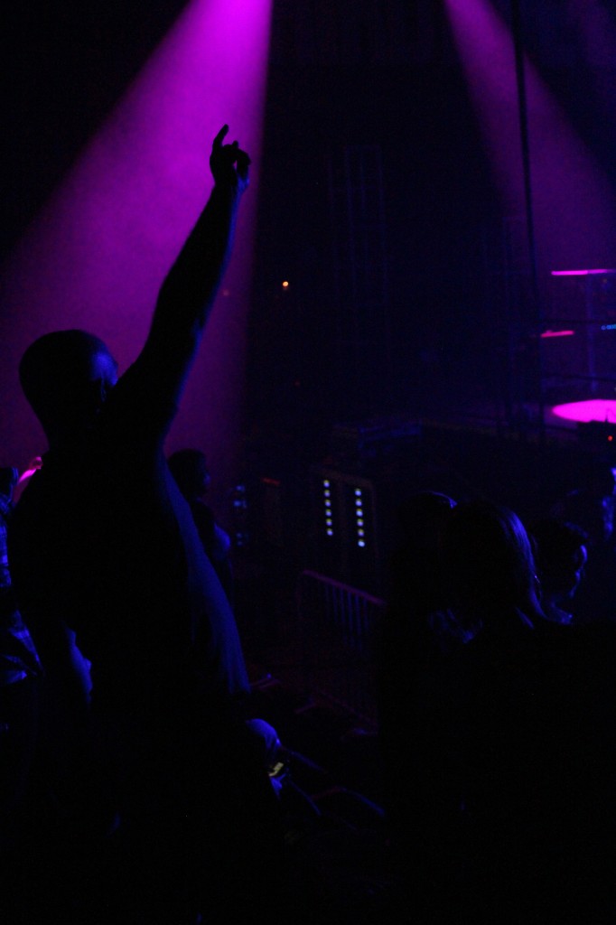 A fan raises his arm during the Third Eye Blind act in the McGuirk Arena on the campus of Central Michigan University, Friday, October 2, 2015.