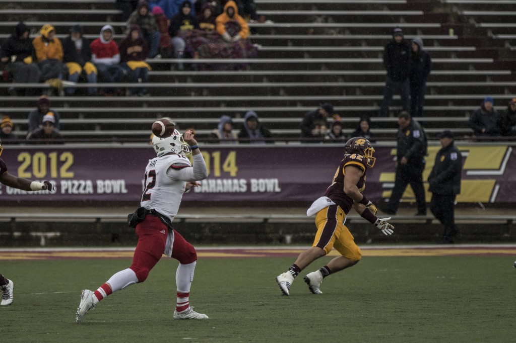 Drew Hare, 12, fumbles the football mid pass attempt during the football game against Northern Illinois University on the campus of Central Michigan University, Mt. Pleasant, MI, Sunday, October 3, 2015.