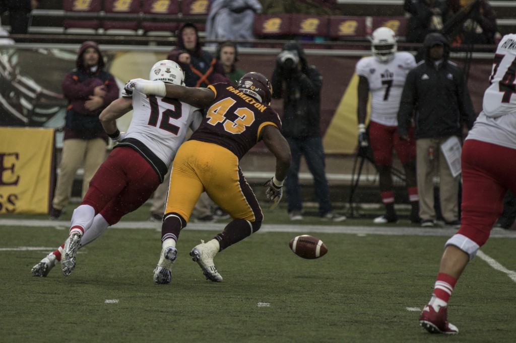 Tim Hamilton, 43, looks to recover a fumble he cause during the football game against Northern Illinois University on the campus of Central Michigan University, Mt. Pleasant, MI, Sunday, October 3, 2015.