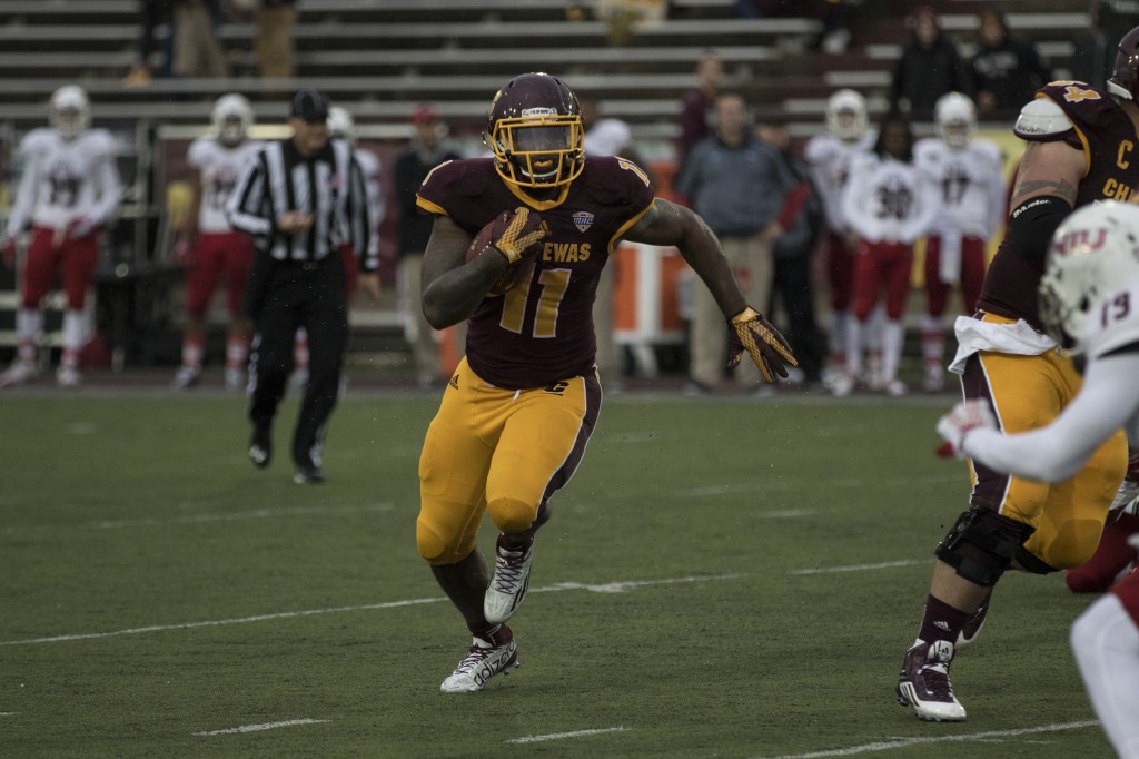 Jahray Hayes, 11, rushes the ball during the football game against Northern Illinois University on the campus of Central Michigan University, Mt. Pleasant, MI, Sunday, October 3, 2015.