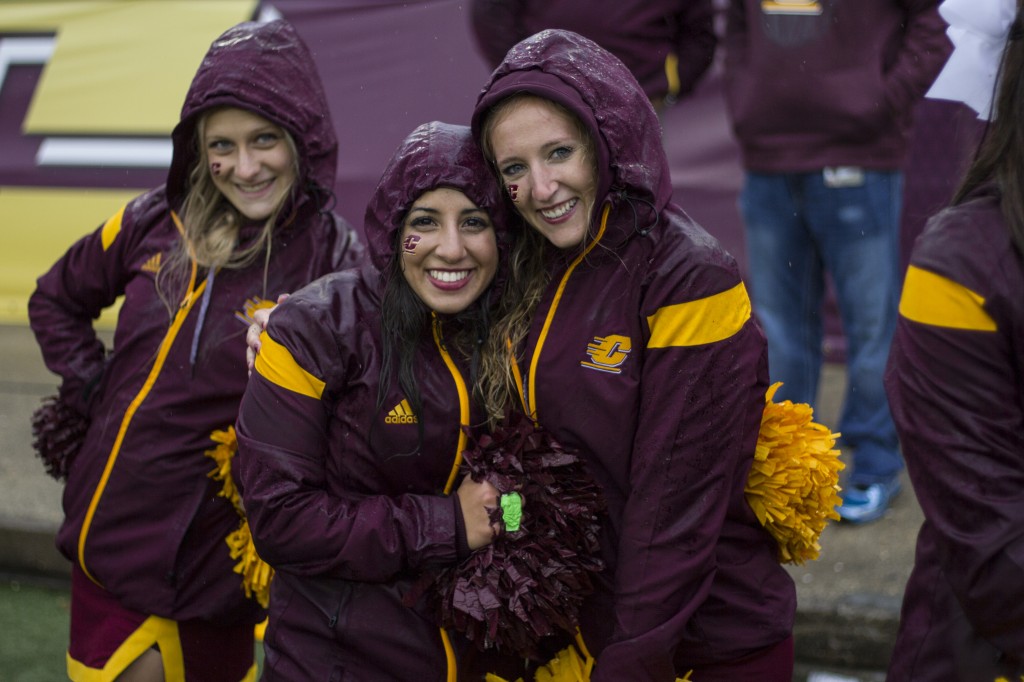 Three cheerleaders pose for a picture during the football game against Northern Illinois University on the campus of Central Michigan University, Mt. Pleasant, MI, Sunday, October 3, 2015.