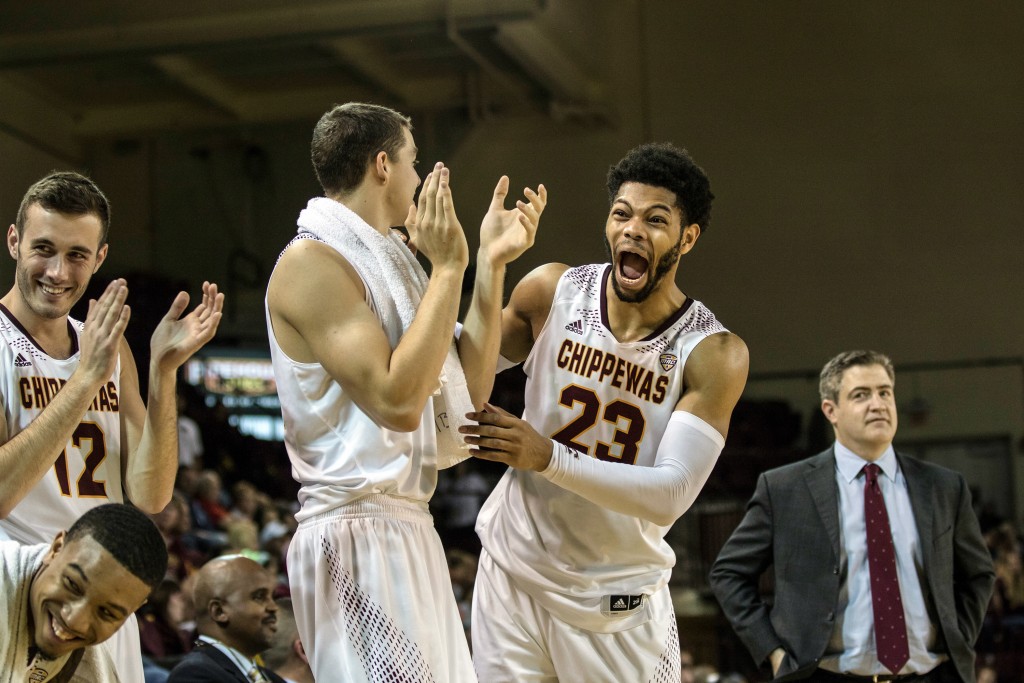 DaRohn Scott, 23, laughs with teammates during the game against Ferris State University in McGuirk Arena on the campus of Central Michigan University, Mt. Pleasant, Michigan, Saturday, November 7, 2015.