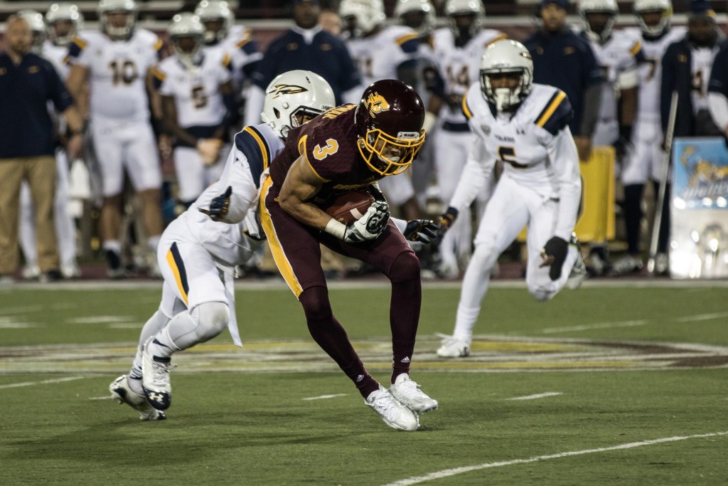 Mark Chapman, 3, catches a ball during the game against the University of Toledo at Kelly Shorts Stadium, on the campus of Central Michigan University, Mt. Pleasant, Michigan, Tuesday, November 10, 2015.