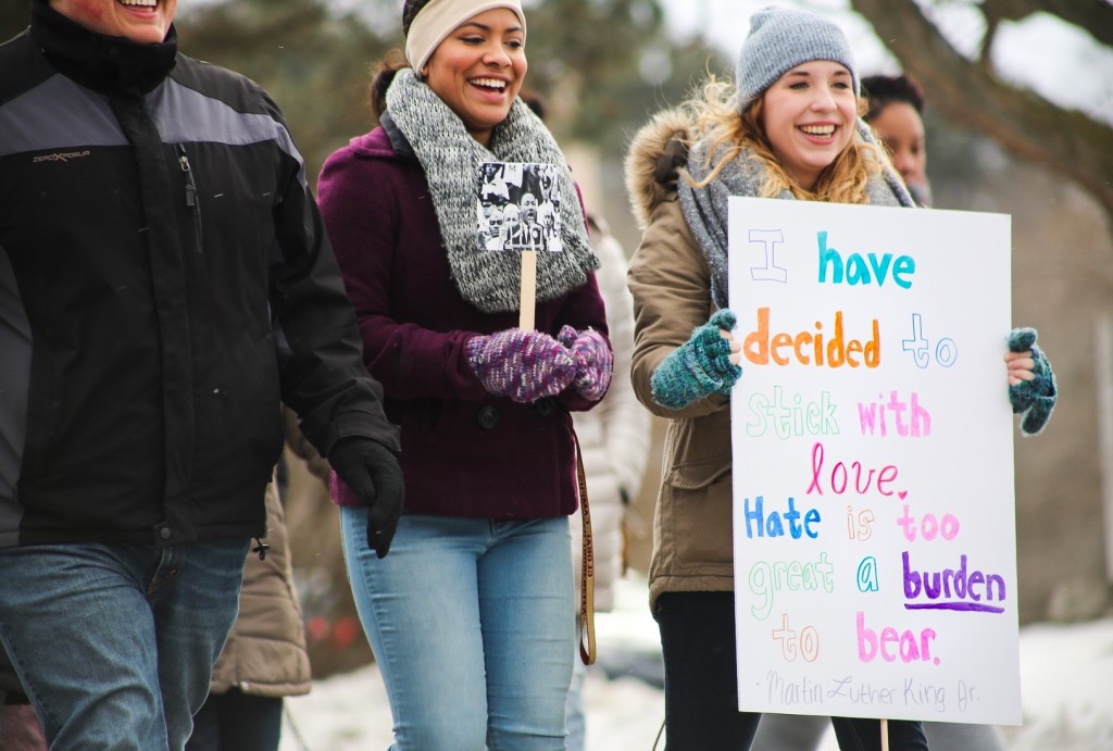 Students carry signs for the MLK march on the campus of Central Michigan University on January 18, 2016. 